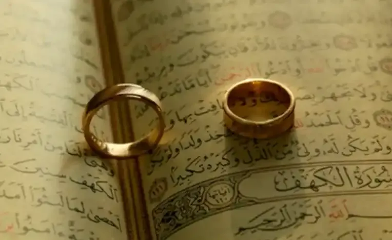 A couple's hands with wedding rings